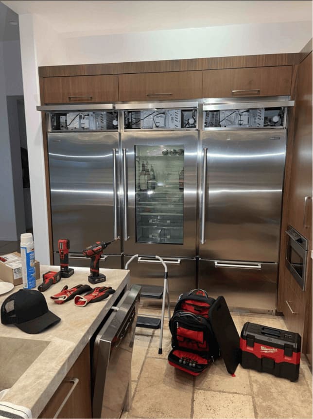 Sub-Zero repair in Tampa — three built-in Sub-Zero refrigerators serviced in a Tampa Bay kitchen